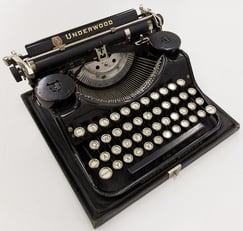 An iconic looking typewriter, branded as "Underwood". It is more modern than the ones discussed in the paragraph.